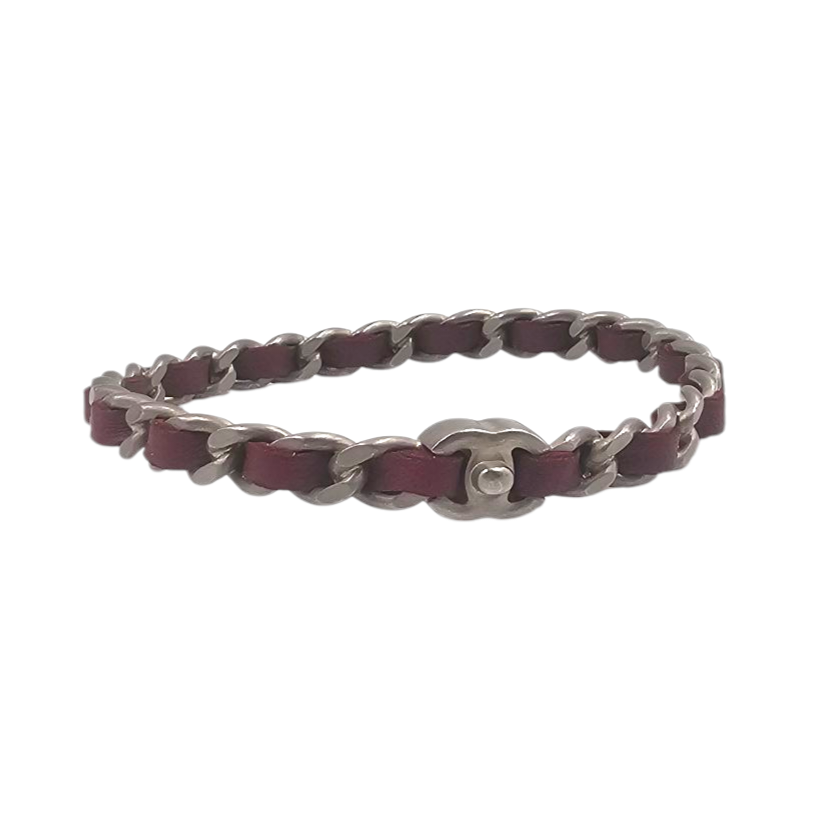 CHANEL PROTOTYPE BRACELET EN METAL VIEILLI ENTRELACE DE CUIR ROUGE CIRCA 1990