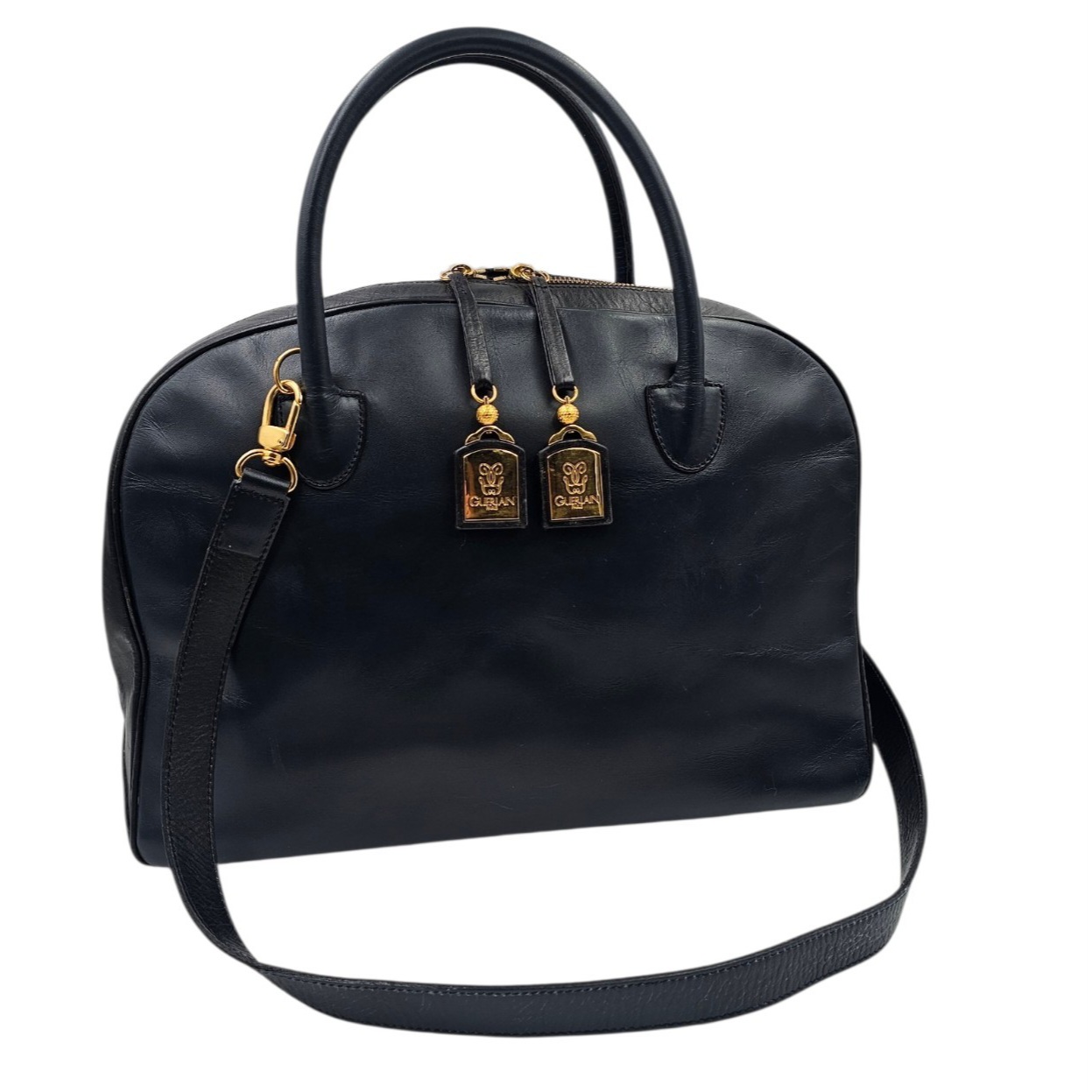 GUERLAIN SAC DE VOYAGE EN CUIR BLEU MARINE ET NOIR (MANQUE 1 PETITE PLAQUE)